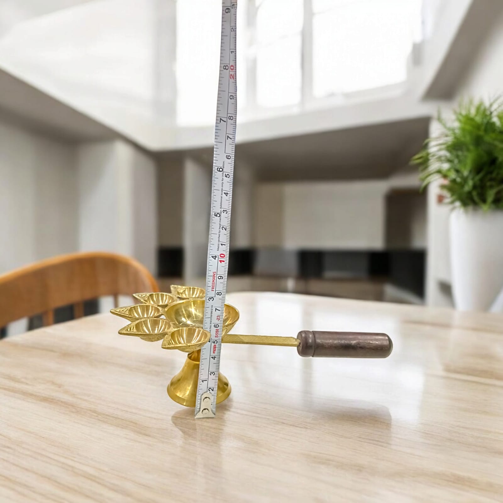 5-face brass Panch Mukhi Jyot with handle, ideal for Aarti, featuring an elegant finish, available at Timeshopee.