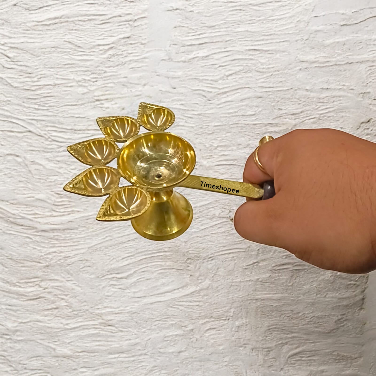 5-face brass Panch Mukhi Jyot with handle, ideal for Aarti, featuring an elegant finish, available at Timeshopee.