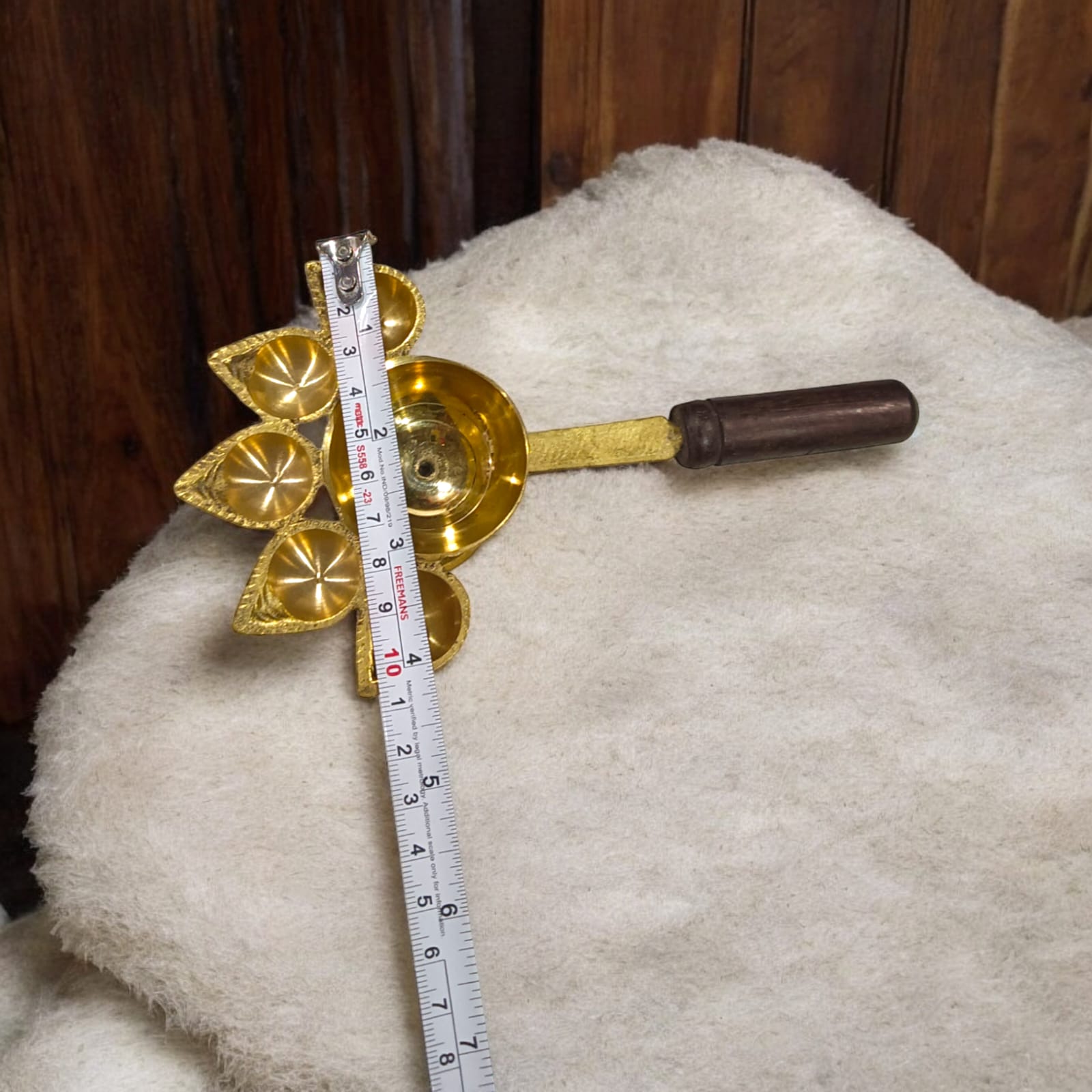 5-face brass Panch Mukhi Jyot with handle, ideal for Aarti, featuring an elegant finish, available at Timeshopee.