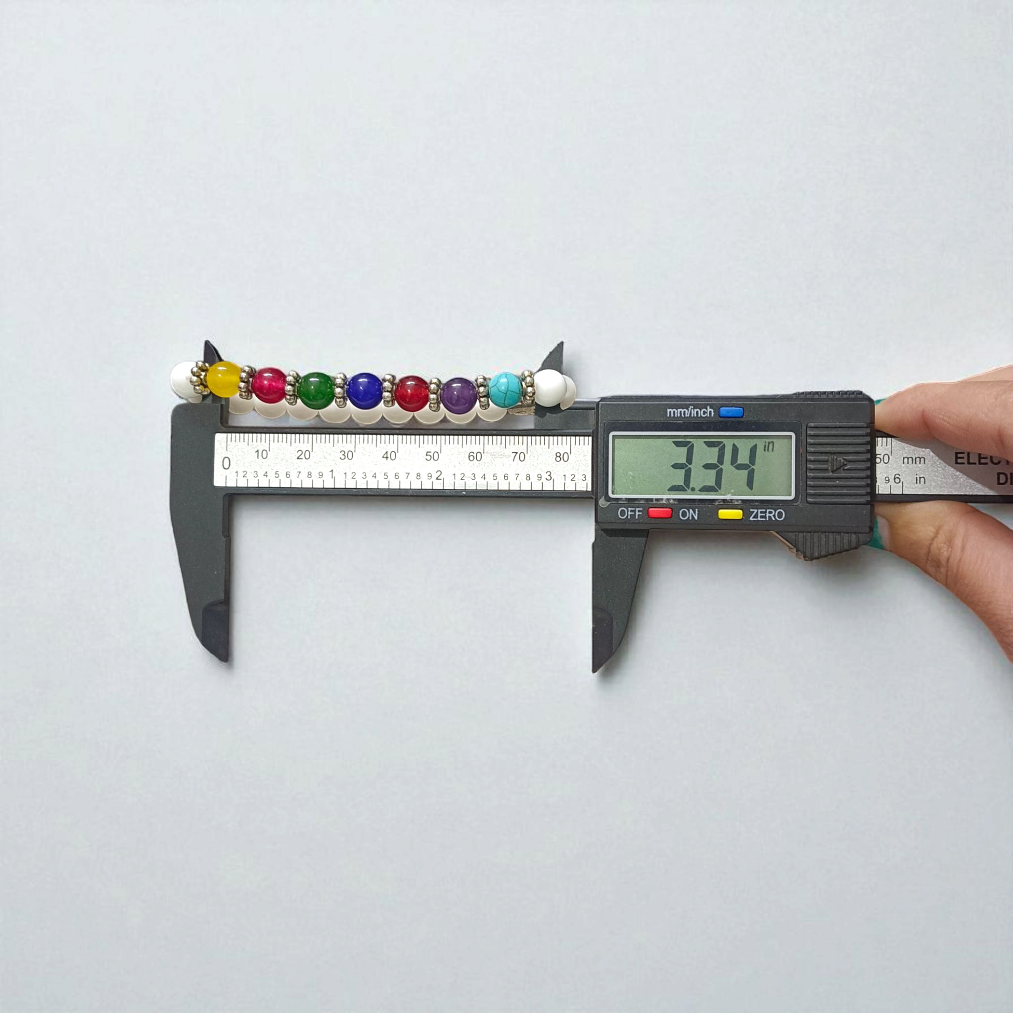 7 Chakra with Howlite Bracelet featuring colorful chakra stones and white howlite beads on an elastic thread, spiritual jewelry for men and women