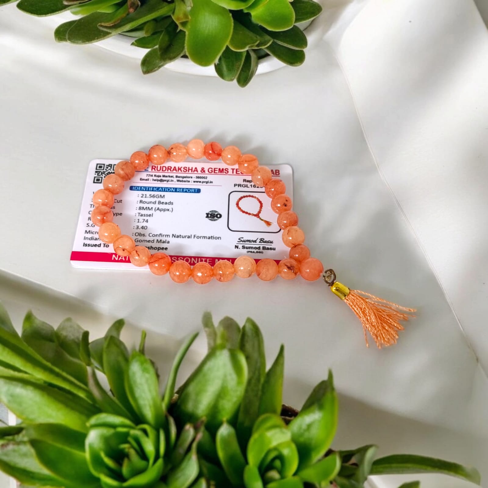 A Hessonite (Gomed) Mala with 27+1 lab-certified deep red gemstone beads, each 8MM in size, designed for meditation, focus, and astrological benefits, ideal for travel, office, and car.