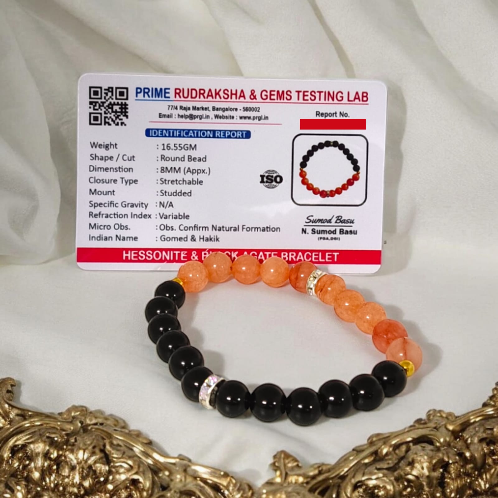 A Hessonite and Black Agate Bracelet with 8MM lab-certified beads, featuring a stretchable design for comfort and spiritual protection.