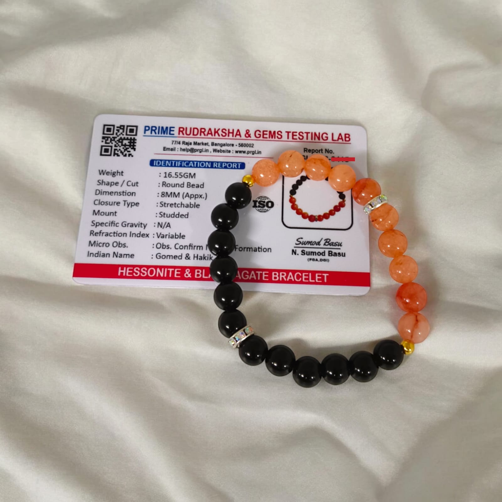 A Hessonite and Black Agate Bracelet with 8MM lab-certified beads, featuring a stretchable design for comfort and spiritual protection.