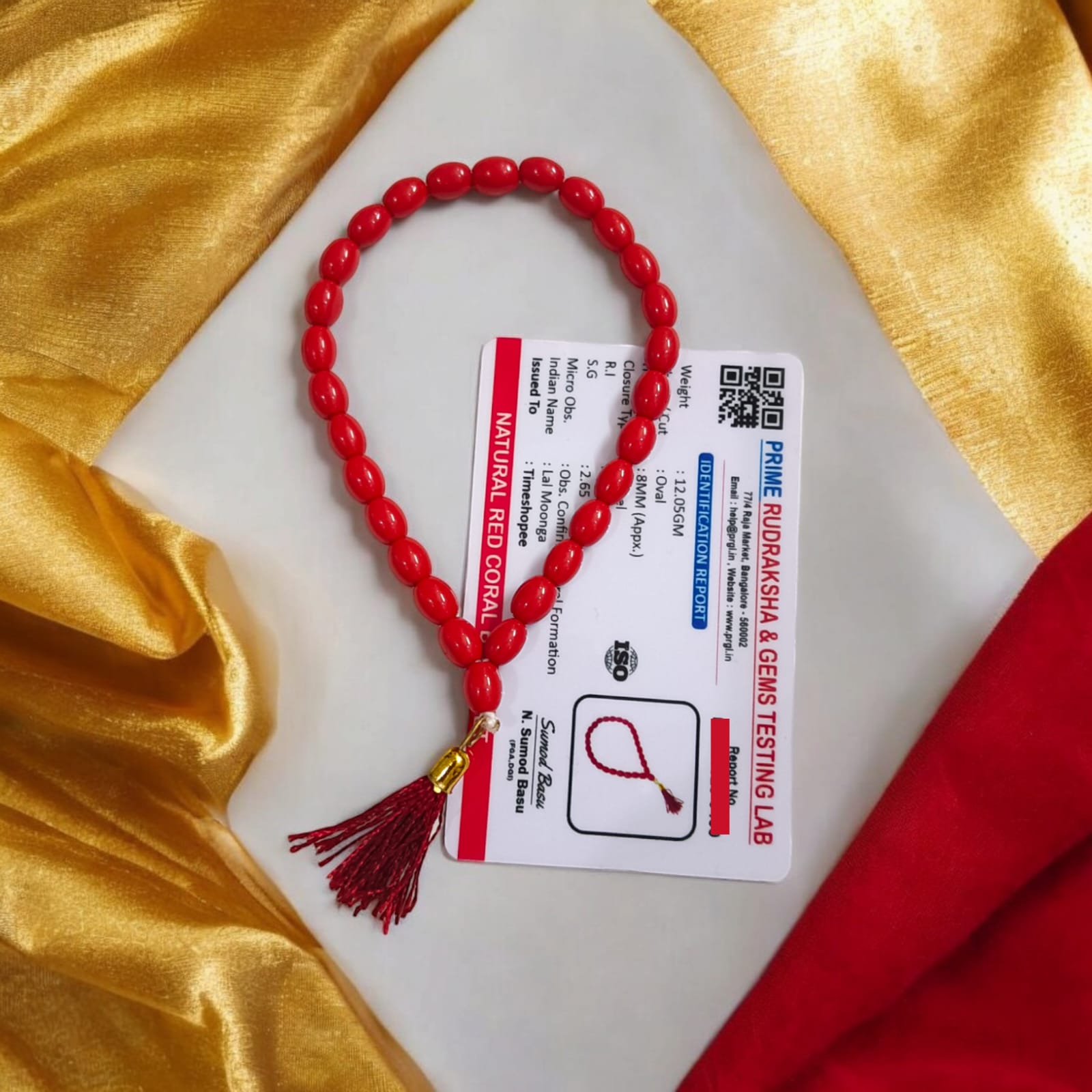 A Lal Moonga Mala featuring 27+1 lab-certified Red Coral beads, each 8MM in size, ideal for car, office, and travel, providing protection and energy balance.