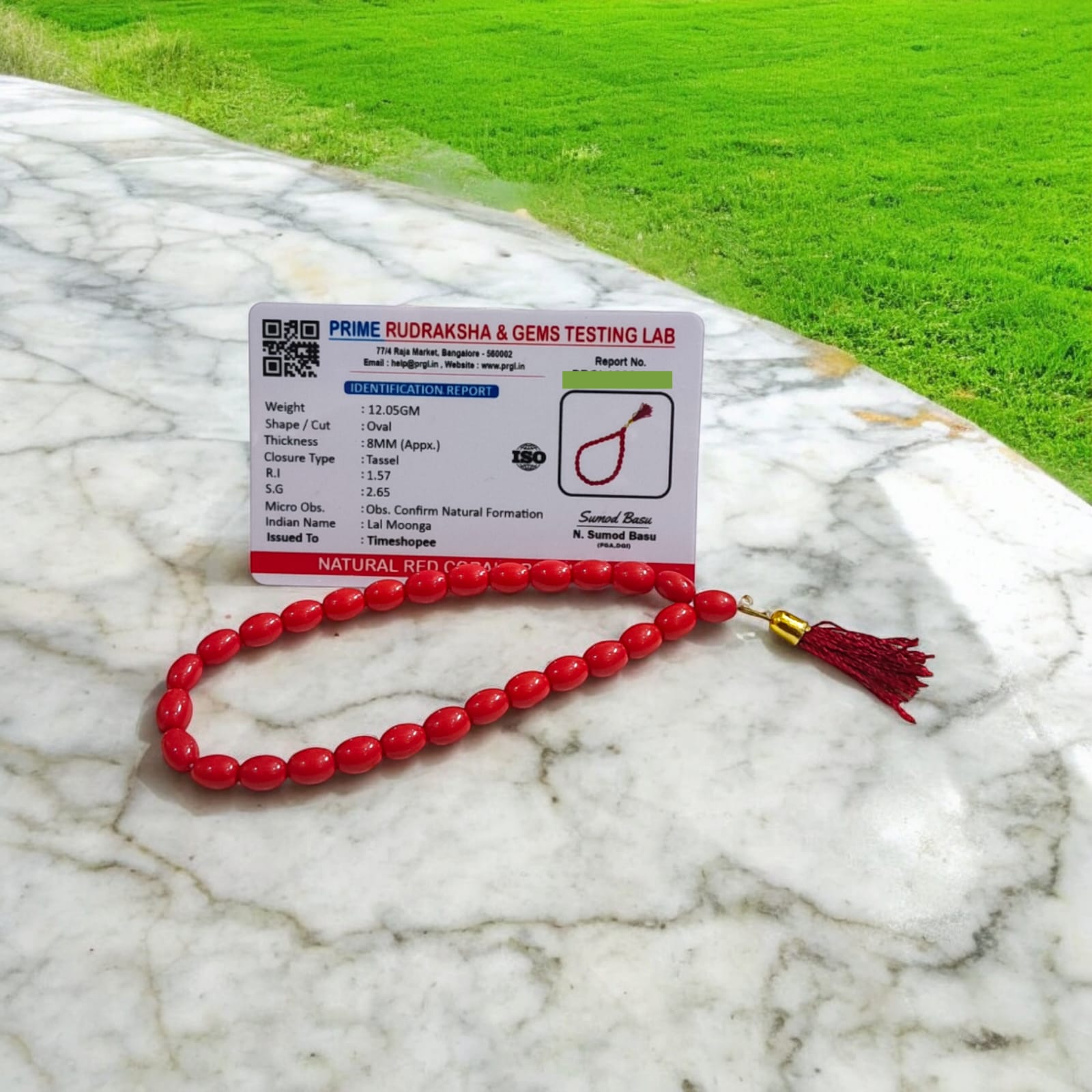 A Lal Moonga Mala featuring 27+1 lab-certified Red Coral beads, each 8MM in size, ideal for car, office, and travel, providing protection and energy balance.