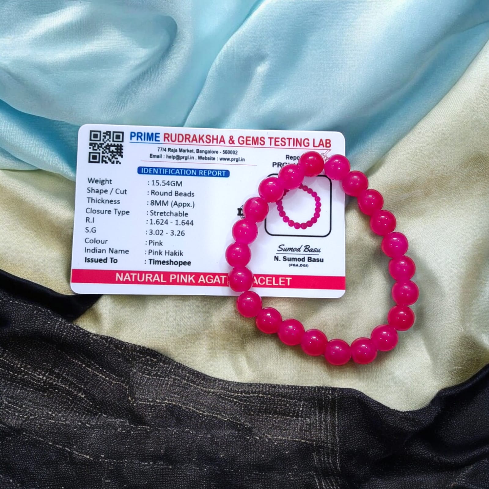 A Pink Agate Bracelet with 8MM lab-certified beads, designed in a stretchable style, offering elegance and spiritual balance.