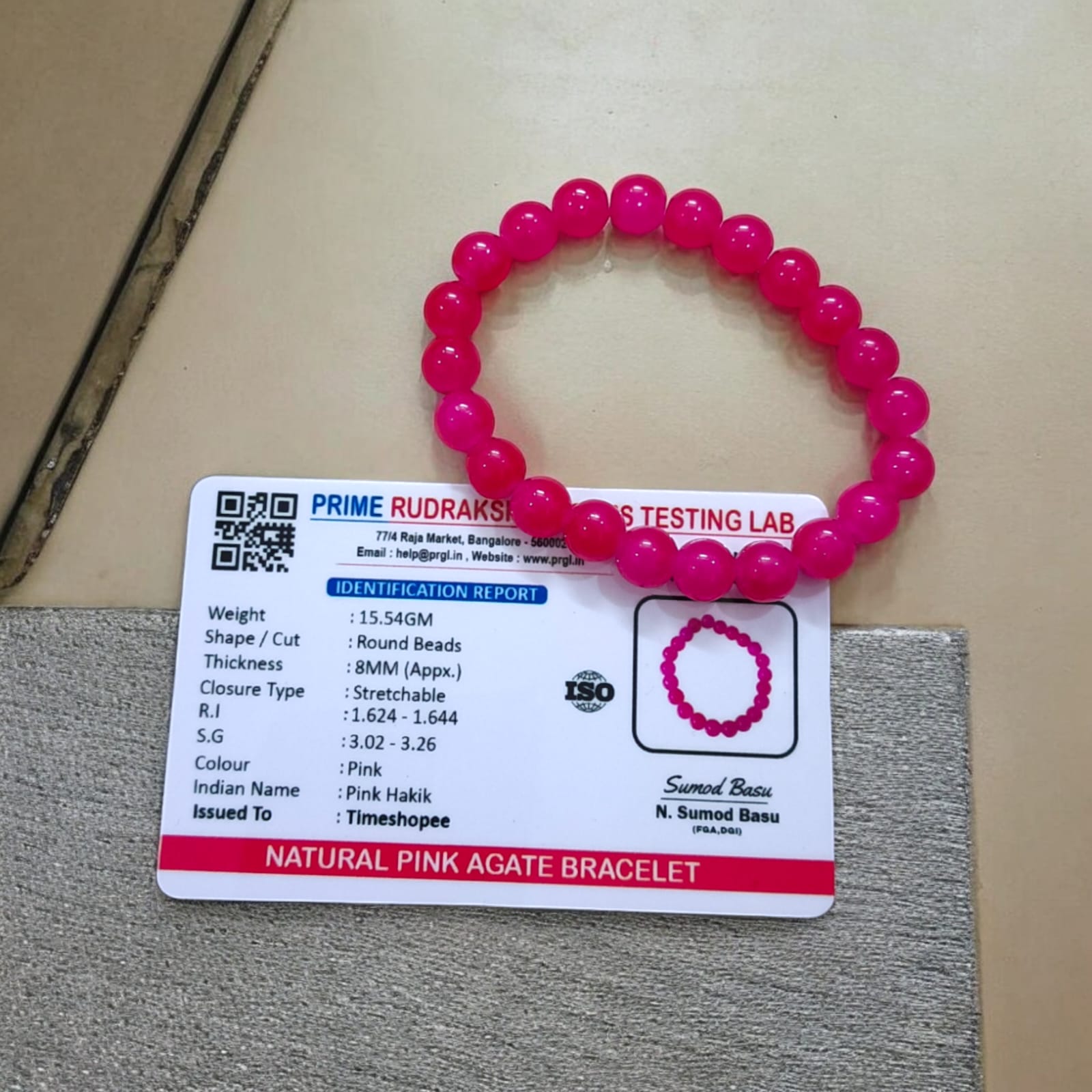 A Pink Agate Bracelet with 8MM lab-certified beads, designed in a stretchable style, offering elegance and spiritual balance.