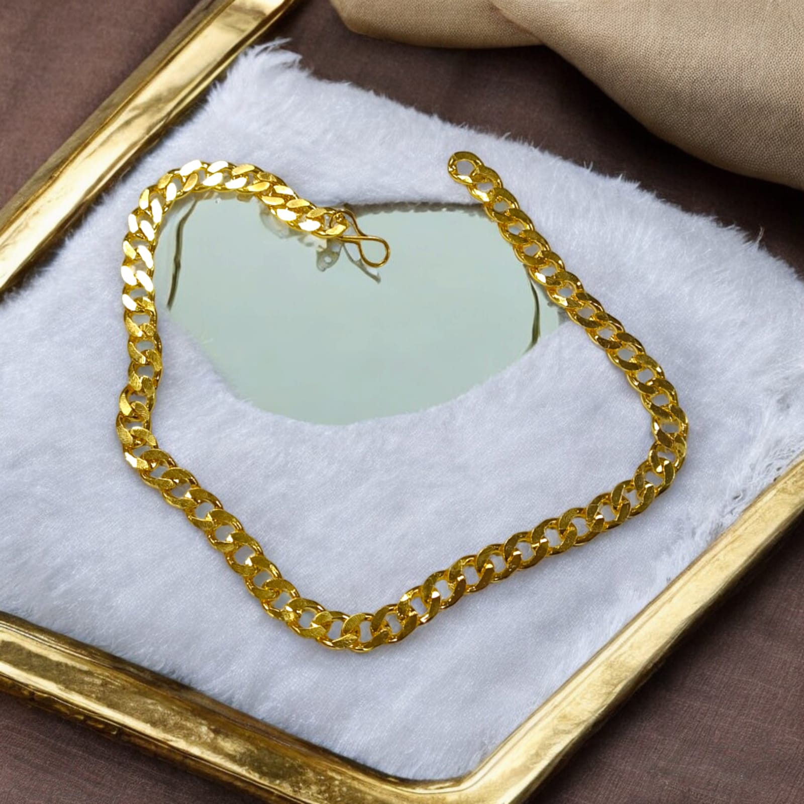 A 20-inch artificial gold chain with a 1-gram gold plating, heavy in design, suitable for boys and men.