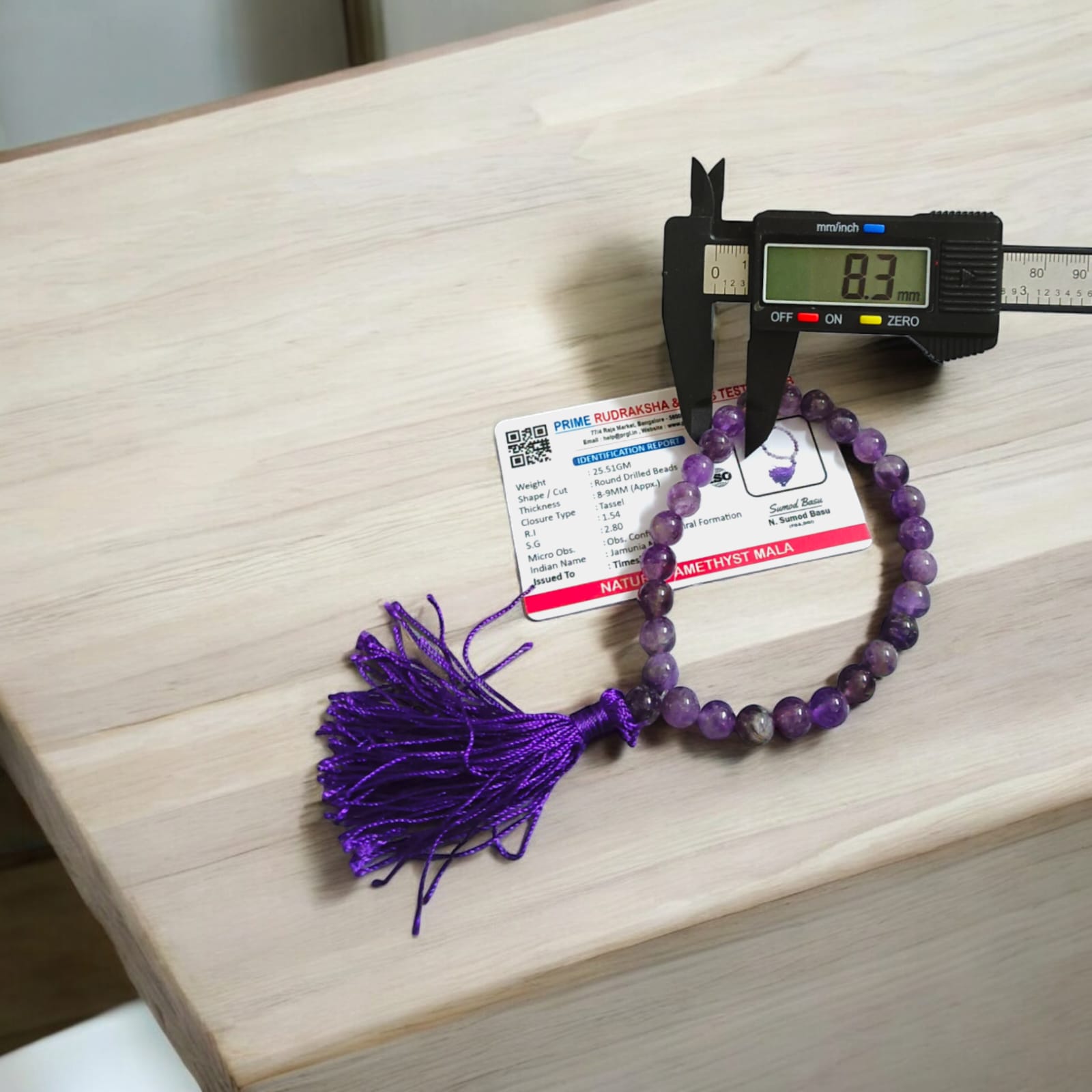 A 27+1 bead Amethyst mala with 8MM lab-certified beads, designed for meditation and jaap, perfect for use in travel, car, or office.