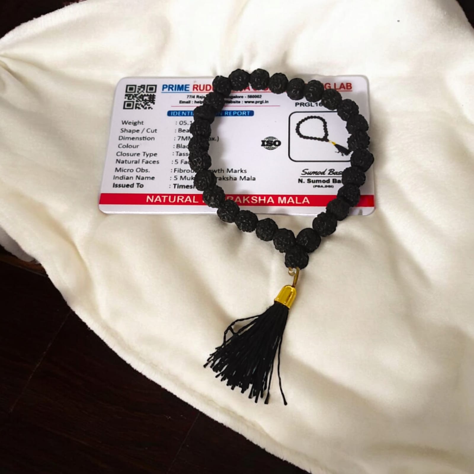A 27+1 bead Black Rudraksha Mala with 7MM-sized beads, elegantly designed for spiritual use. Suitable for car, office, or travel, the lab-certified beads offer protection and a calming influence.