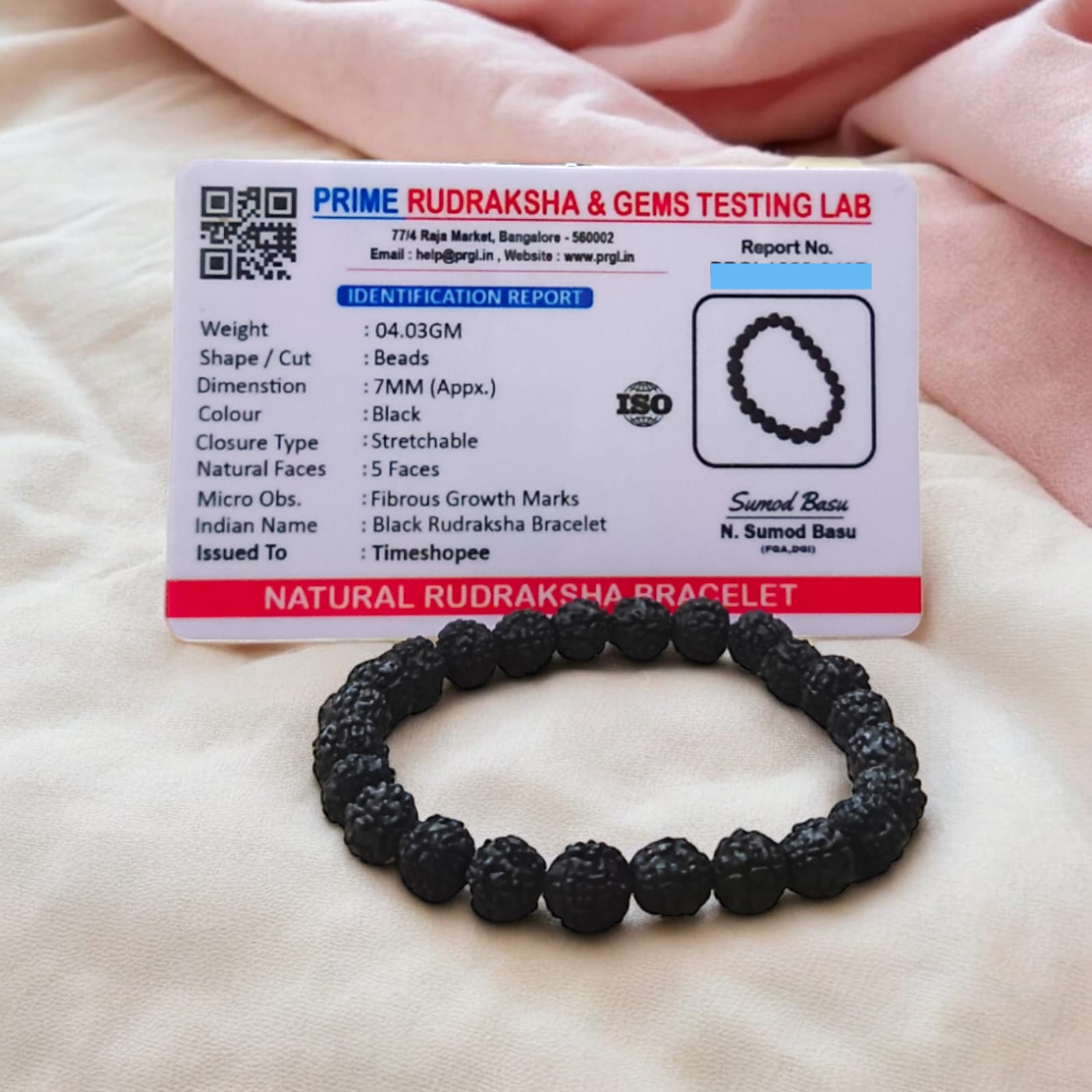 A Black Rudraksha Bracelet with 7MM lab-certified beads, elegantly arranged in a stretchable design, perfect for meditation and daily wear.