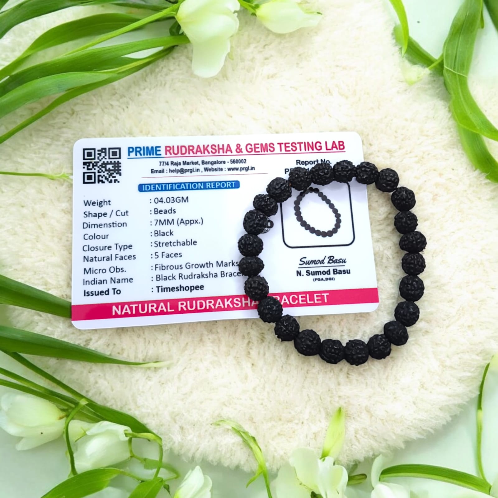 A Black Rudraksha Bracelet with 7MM lab-certified beads, elegantly arranged in a stretchable design, perfect for meditation and daily wear.