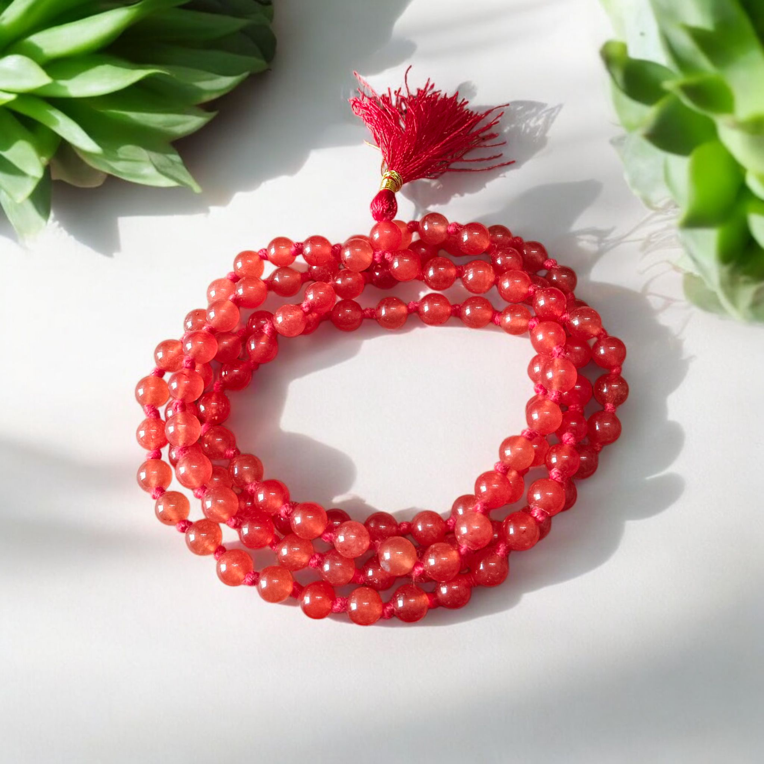 A Hessonite (Gomed) Mala with 27+1 lab-certified deep red gemstone beads, each 8MM in size, designed for meditation, focus, and astrological benefits, ideal for travel, office, and car.