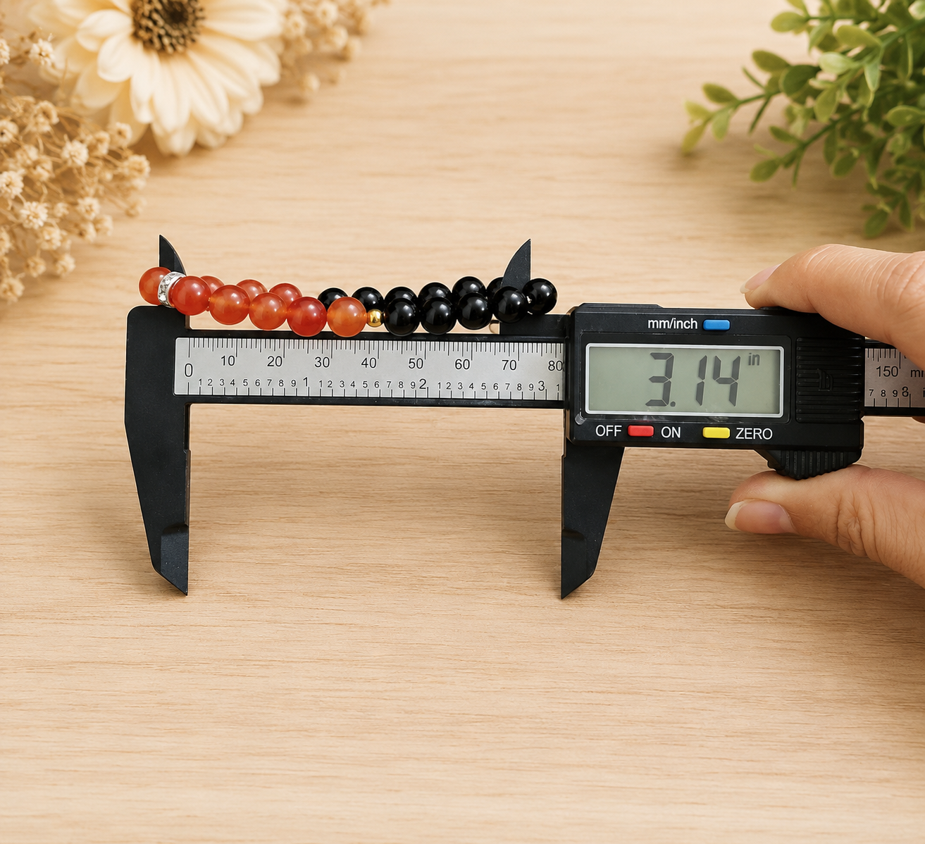 A Hessonite and Black Agate Bracelet with 8MM lab-certified beads, featuring a stretchable design for comfort and spiritual protection