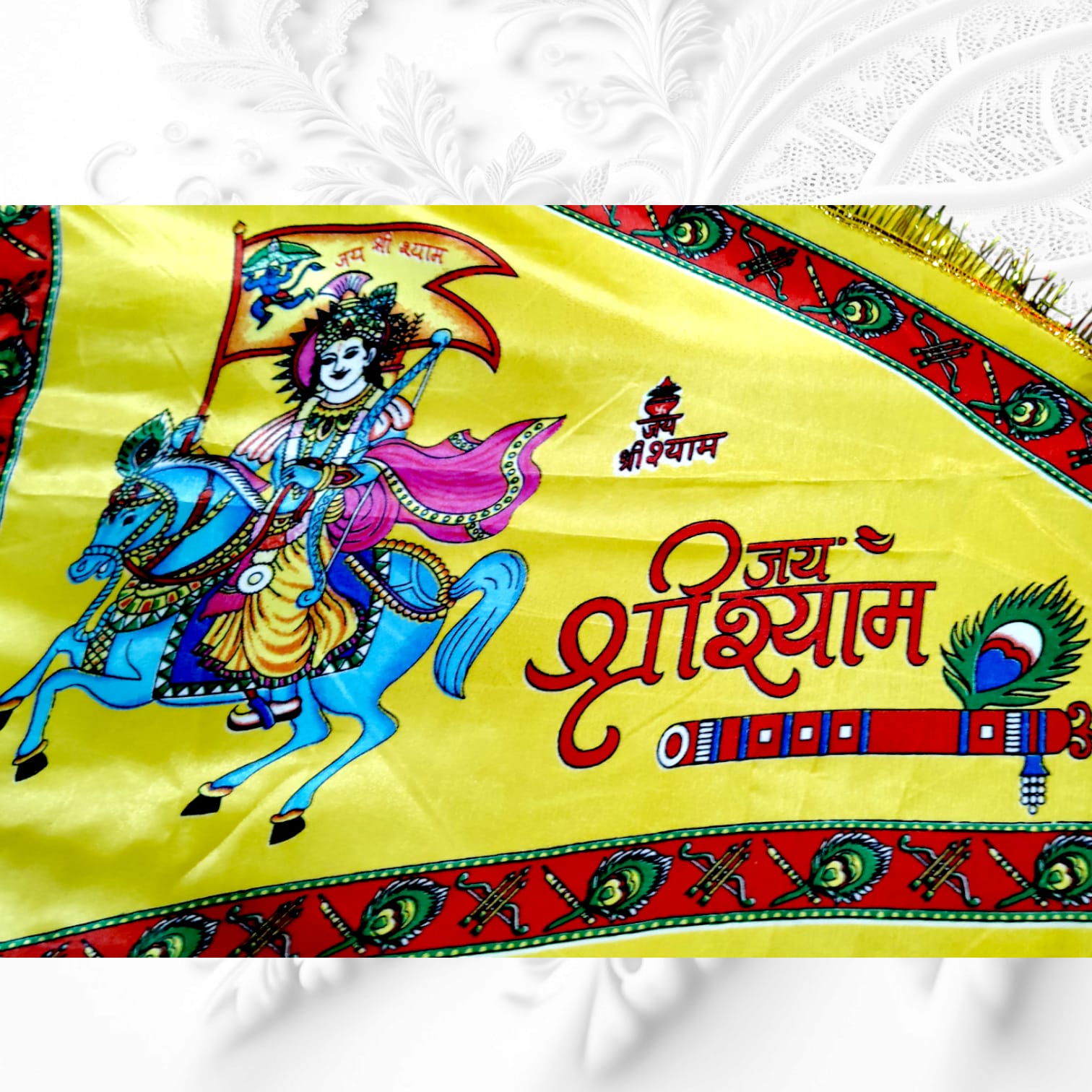 A Khatu Shyam Ji Nisan Triangle Flag, available in different sizes and colors, perfect for temples, homes, and offices.
