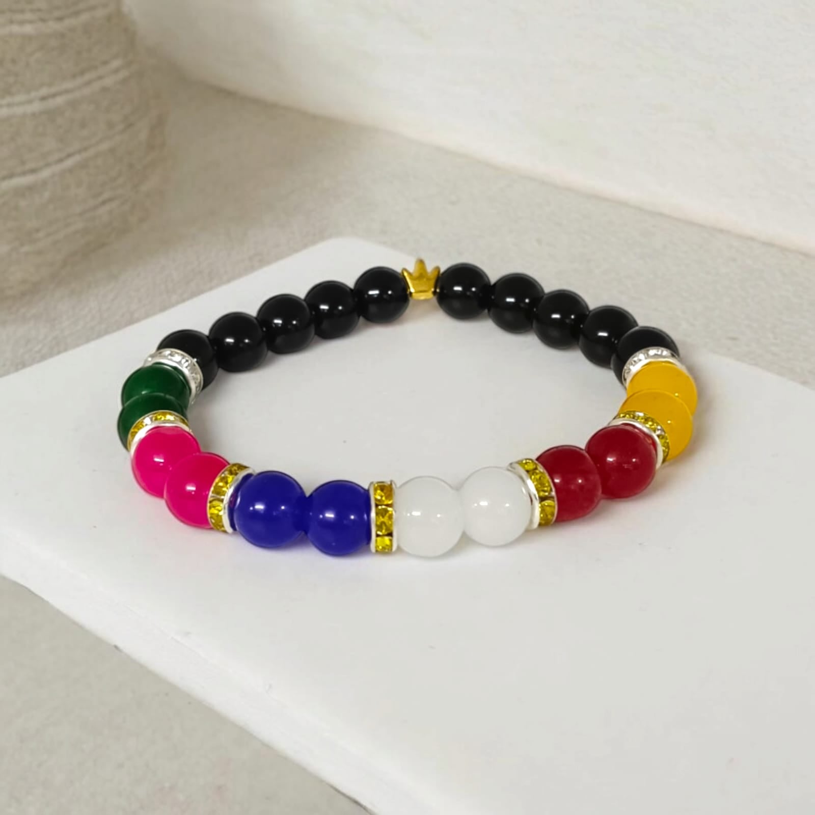A Mix Agate Bracelet with 7 types of Agate stones: Pink, White, Black, Green, Red, Yellow, and Blue. Features 8MM lab-certified beads in a stretchable design for balance and protection.