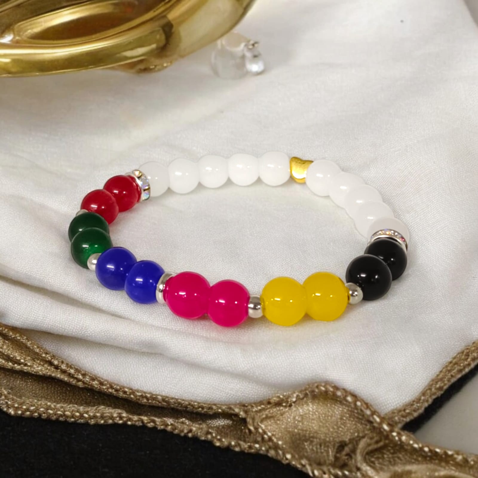 A Mix Agate Bracelet with 7 types of Agate stones: Pink, White, Black, Green, Red, Yellow, and Blue. Features 8MM lab-certified beads in a stretchable design for balance and protection.