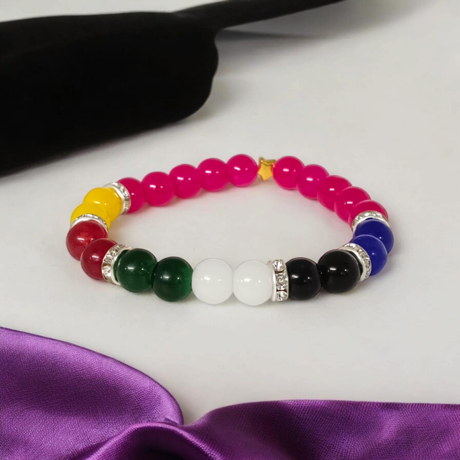 A Mix Agate Bracelet with 7 types of Agate stones: Pink, White, Black, Green, Red, Yellow, and Blue. Features 8MM lab-certified beads in a stretchable design for balance and protection.