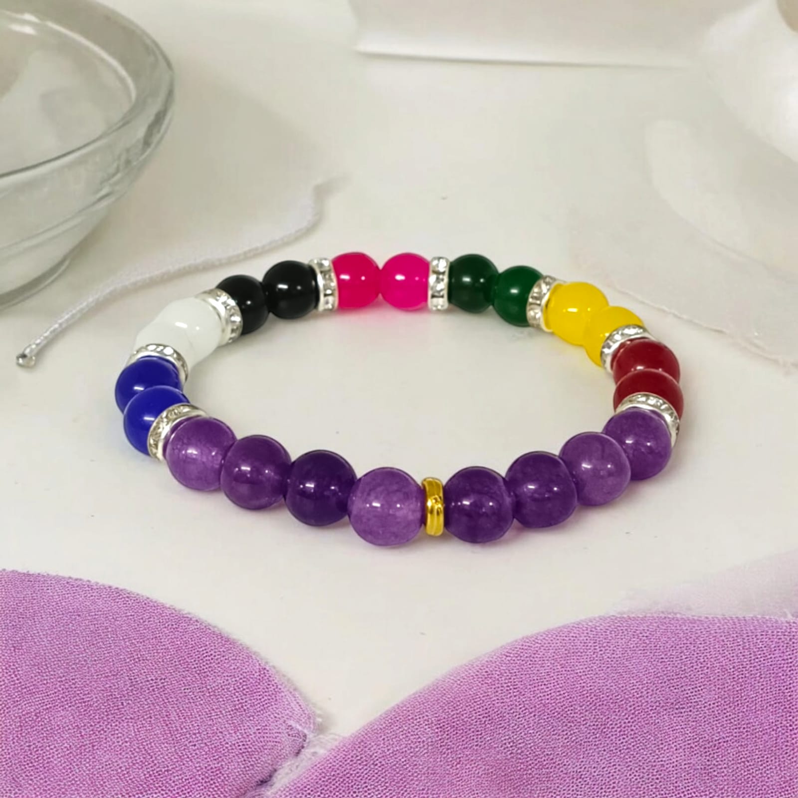 A Mix Agate and Amethyst Bracelet with 8MM lab-certified beads, featuring 7 types of Agate stones and Amethyst, in a stretchable design for balance and spiritual growth.
