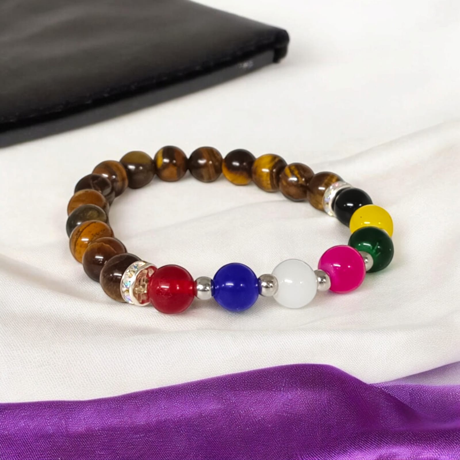 A Mix Agate and Tiger Eye's Bracelet with 8MM lab-certified beads, featuring 7 types of Agate stones and Tiger Eye beads in a stretchable design for protection and balance.