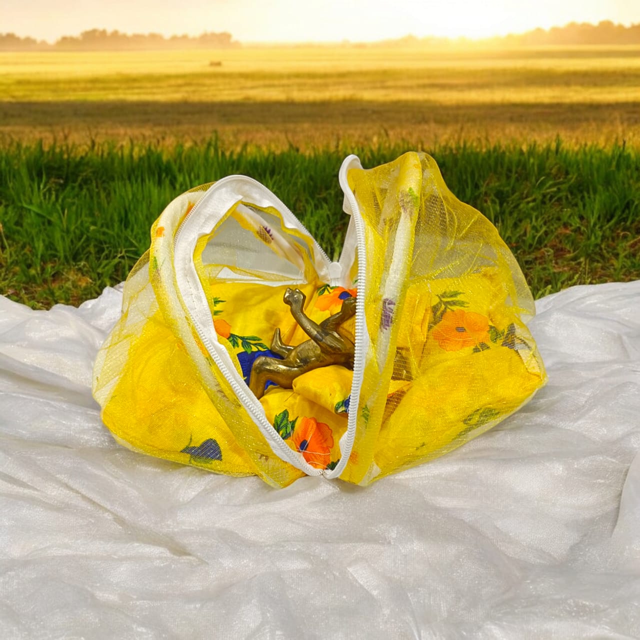 A beautiful 7X10 inch comfortable bed with a mosquito net and three pillows, designed for Laddu Gopal or Radha Rani, available in five vibrant colors for temple use.