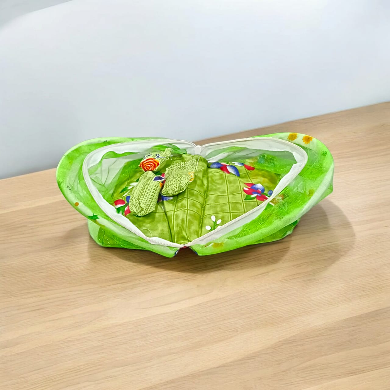 A beautiful 7X10 inch comfortable bed with a mosquito net and three pillows, designed for Laddu Gopal or Radha Rani, available in five vibrant colors for temple use.