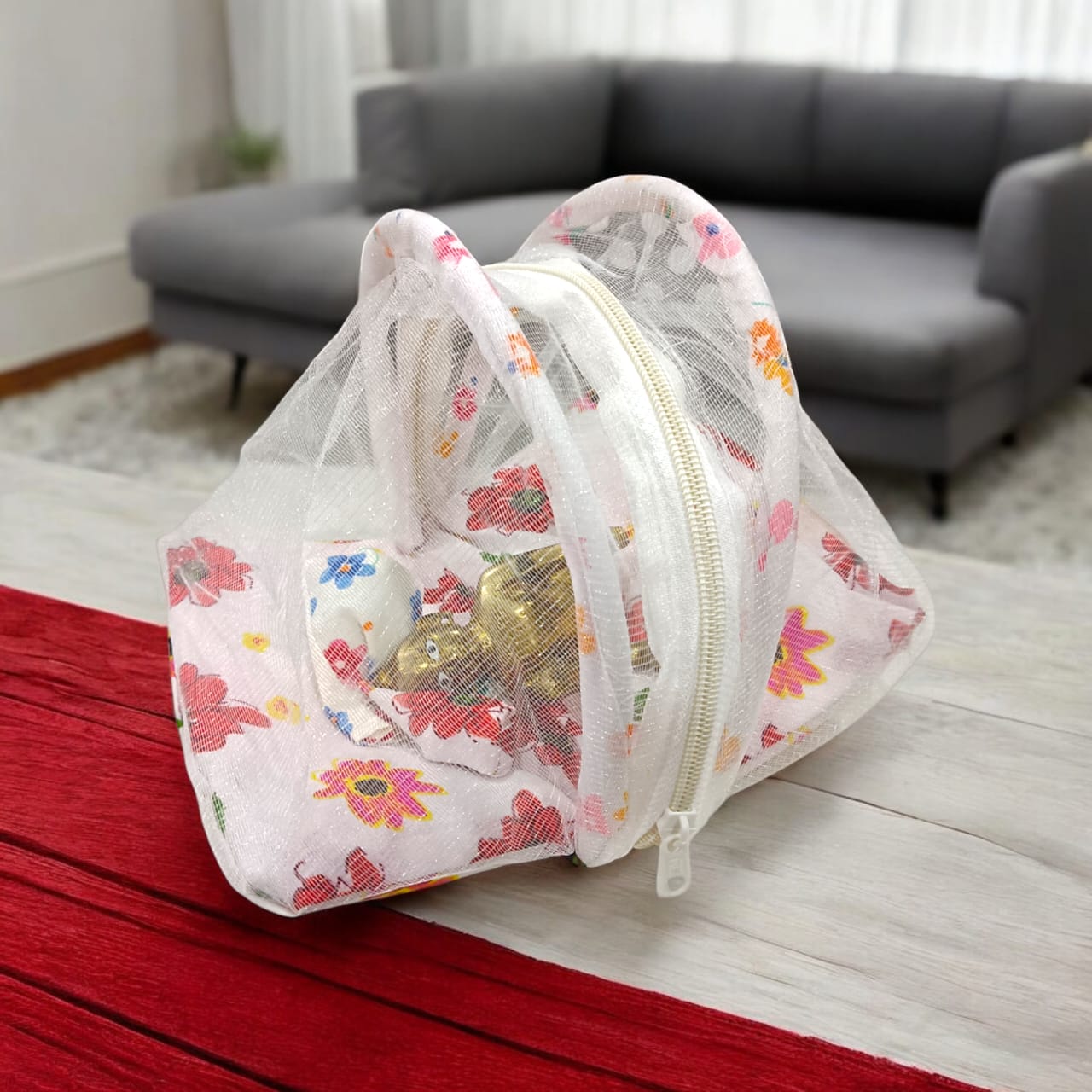 A beautiful 7X10 inch comfortable bed with a mosquito net and three pillows, designed for Laddu Gopal or Radha Rani, available in five vibrant colors for temple use.