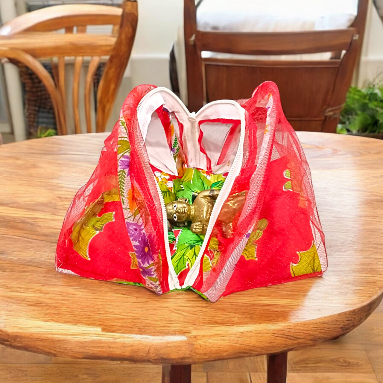 A beautiful 7X10 inch comfortable bed with a mosquito net and three pillows, designed for Laddu Gopal or Radha Rani, available in five vibrant colors for temple use.