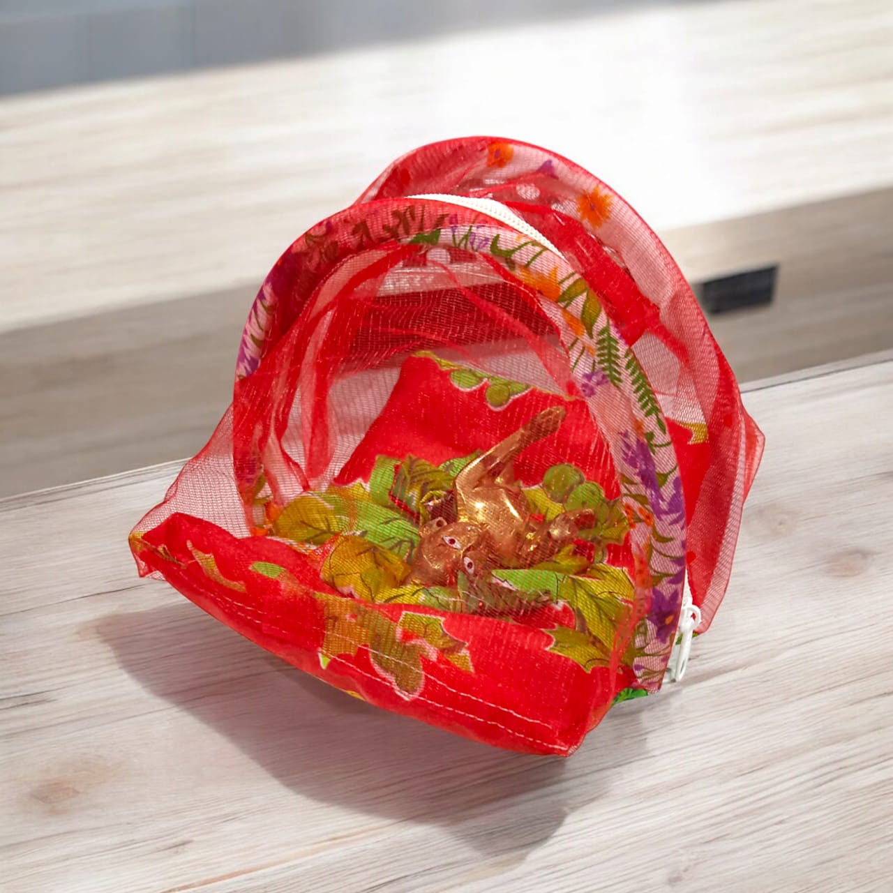 A beautiful 7X10 inch comfortable bed with a mosquito net and three pillows, designed for Laddu Gopal or Radha Rani, available in five vibrant colors for temple use.