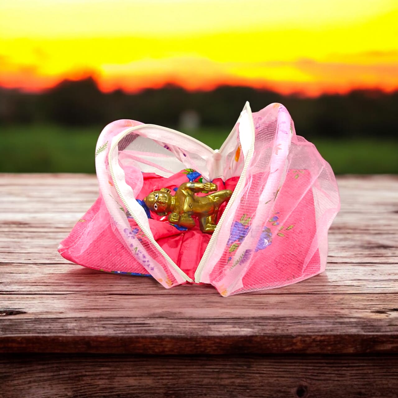 A beautiful 7X10 inch comfortable bed with a mosquito net and three pillows, designed for Laddu Gopal or Radha Rani, available in five vibrant colors for temple use.