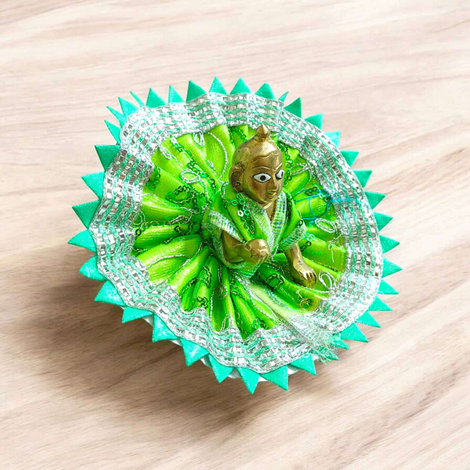 A beautiful Laddu Gopal dress featuring a zig zag border design, crafted for Size 2 Lord Krishna idols, perfect for poojas and festivals.