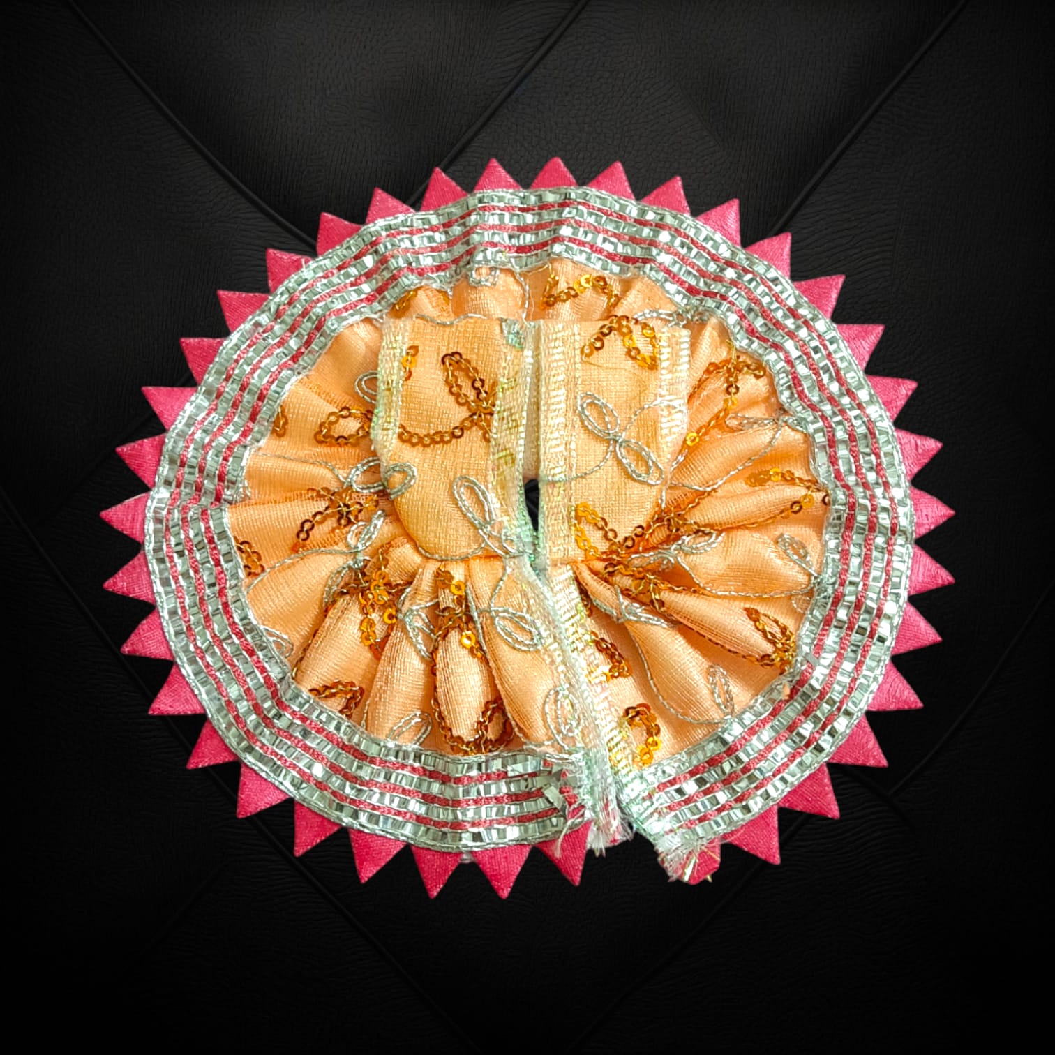 A beautiful Laddu Gopal dress featuring a zig zag border design, crafted for Size 2 Lord Krishna idols, perfect for poojas and festivals.