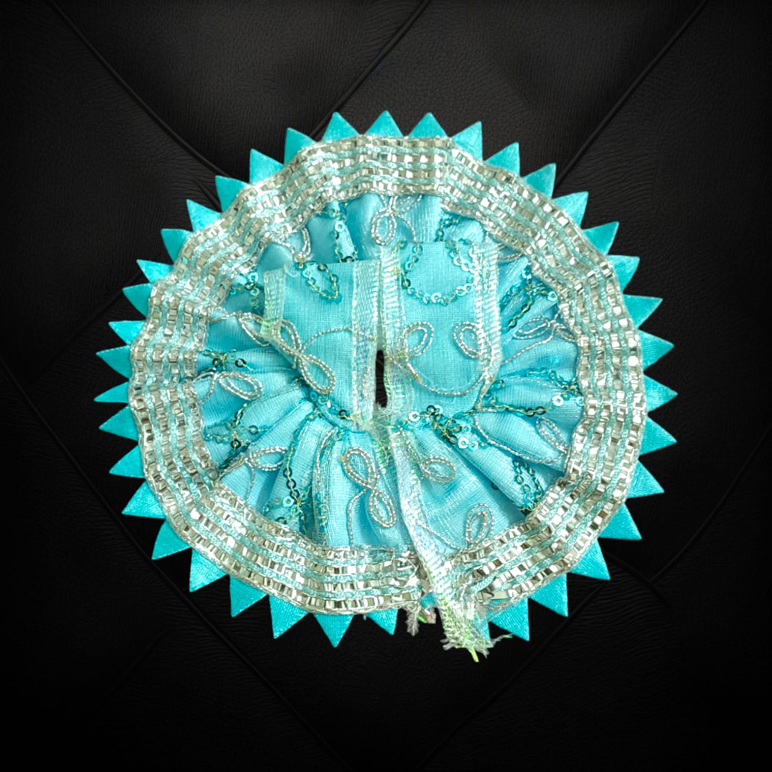 A beautiful Laddu Gopal dress featuring a zig zag border design, crafted for Size 2 Lord Krishna idols, perfect for poojas and festivals.