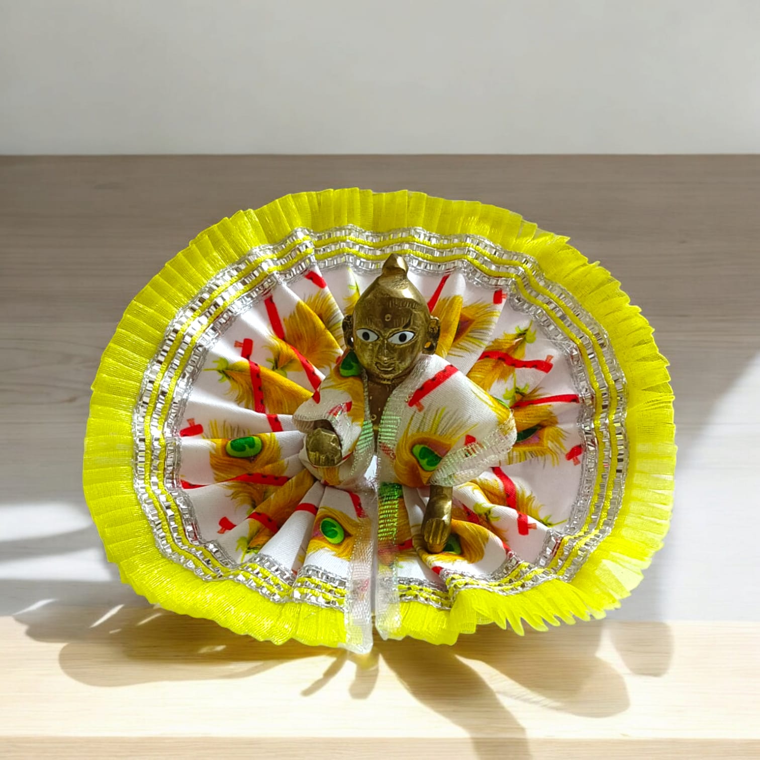 A beautiful Laddu Gopal dress with a stylish lace border, designed for Size 3 Laddu Gopal Ji, perfect for daily worship or festive occasions.