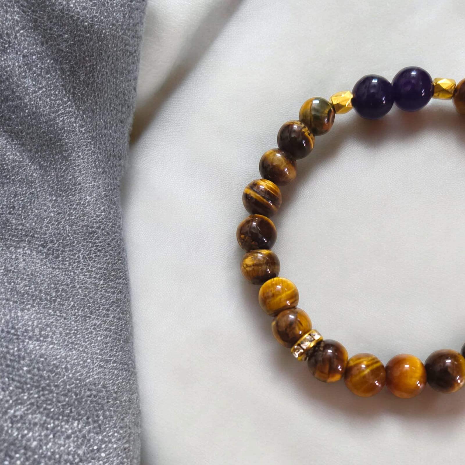 A beautiful Tiger Eye & Amethyst bracelet with 8MM lab-certified natural beads designed to increase courage, confidence, and mental clarity.