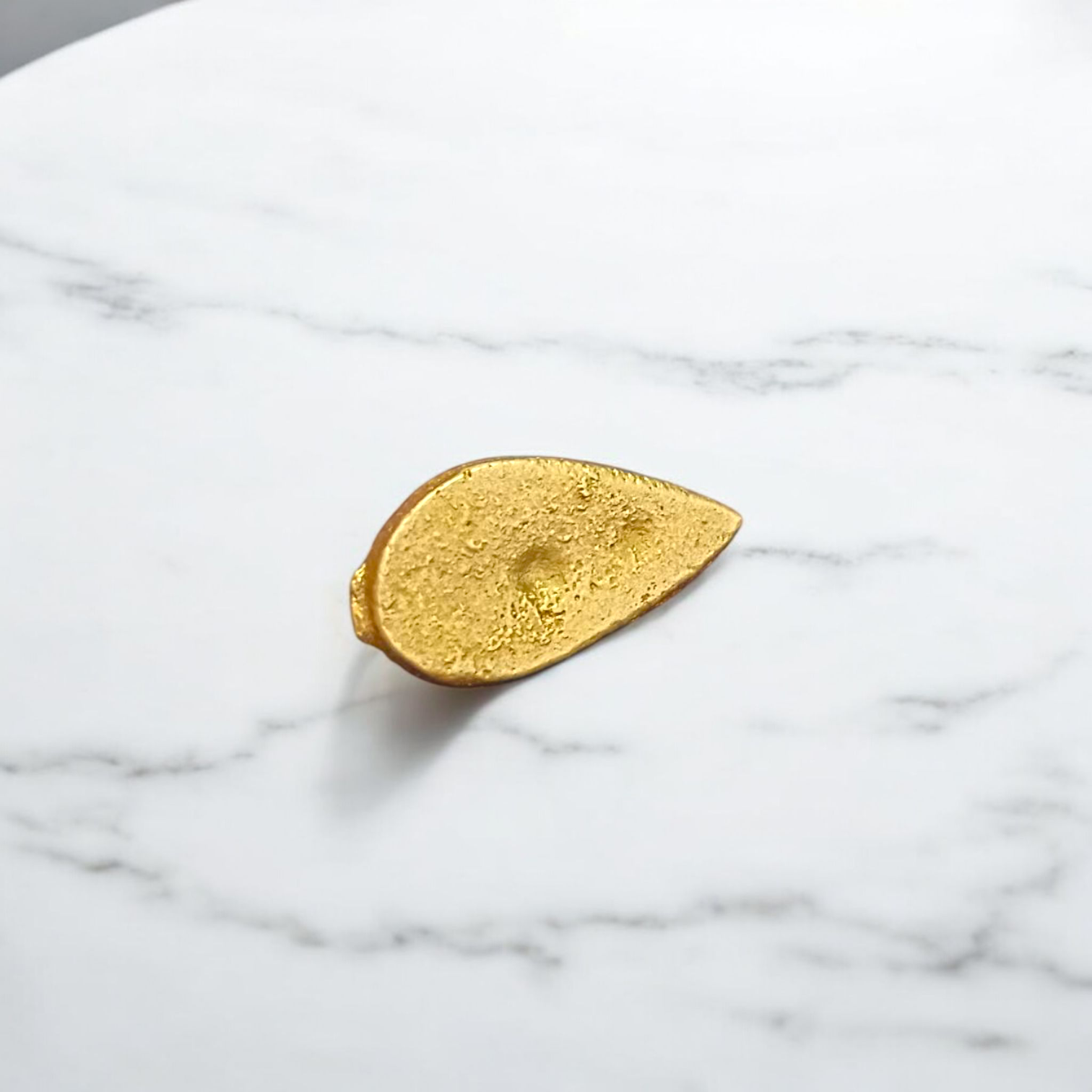 A beautifully crafted Prabhu Tilak Stamp designed for easy and sacred tilak application, shown with kumkum for spiritual rituals