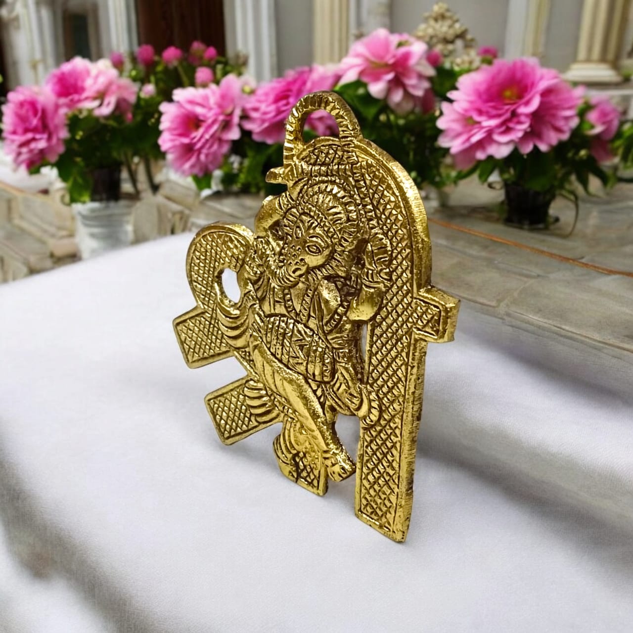 A beautifully crafted brass wall hanging of Shri Ganesh, measuring 11X11 CM, suitable for decorating temple walls, office spaces, and home doors.