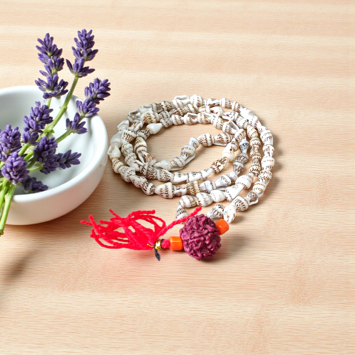 A beautifully handcrafted Shankh Mala (Conch Mala) made from white conch shells, used for meditation and spiritual practices, displayed with certification