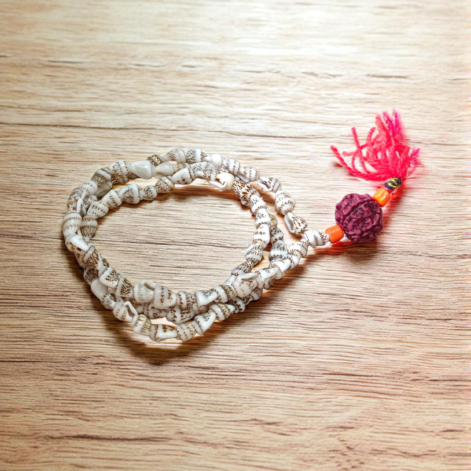 A beautifully handcrafted Shankh Mala (Conch Mala) made from white conch shells, used for meditation and spiritual practices, displayed with certification