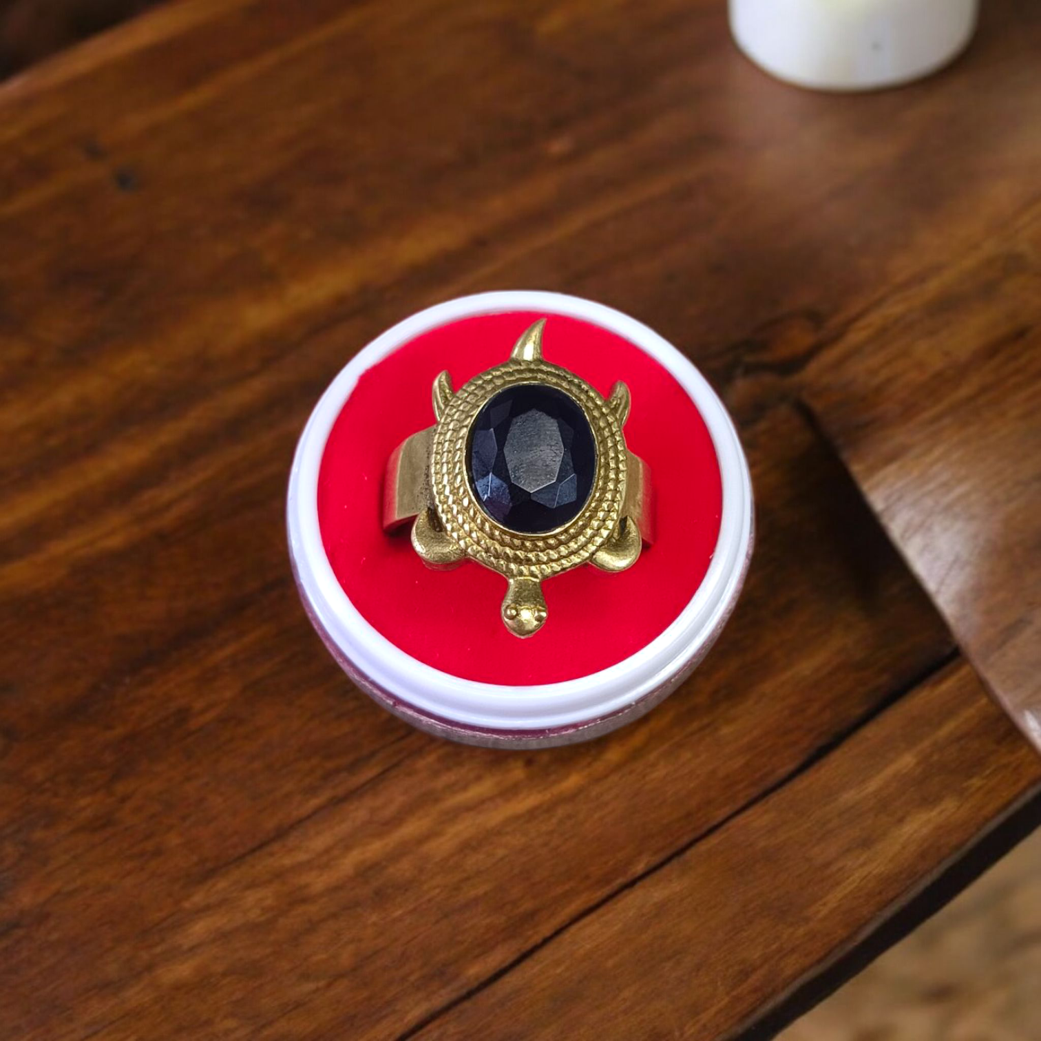 A close-up of the Kachua Black Hakik Ring, showcasing a deep black Kala Hakik (Black Agate) gemstone set in a tortoise-shaped design made from Ashtdhatu. The ring is adjustable and suitable for both men and women.
