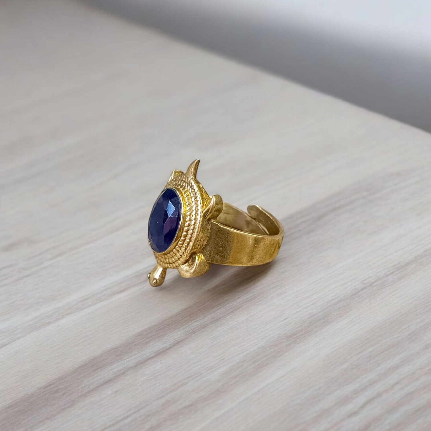 A close-up of the Kachua Black Hakik Ring, showcasing a deep black Kala Hakik (Black Agate) gemstone set in a tortoise-shaped design made from Ashtdhatu. The ring is adjustable and suitable for both men and women.