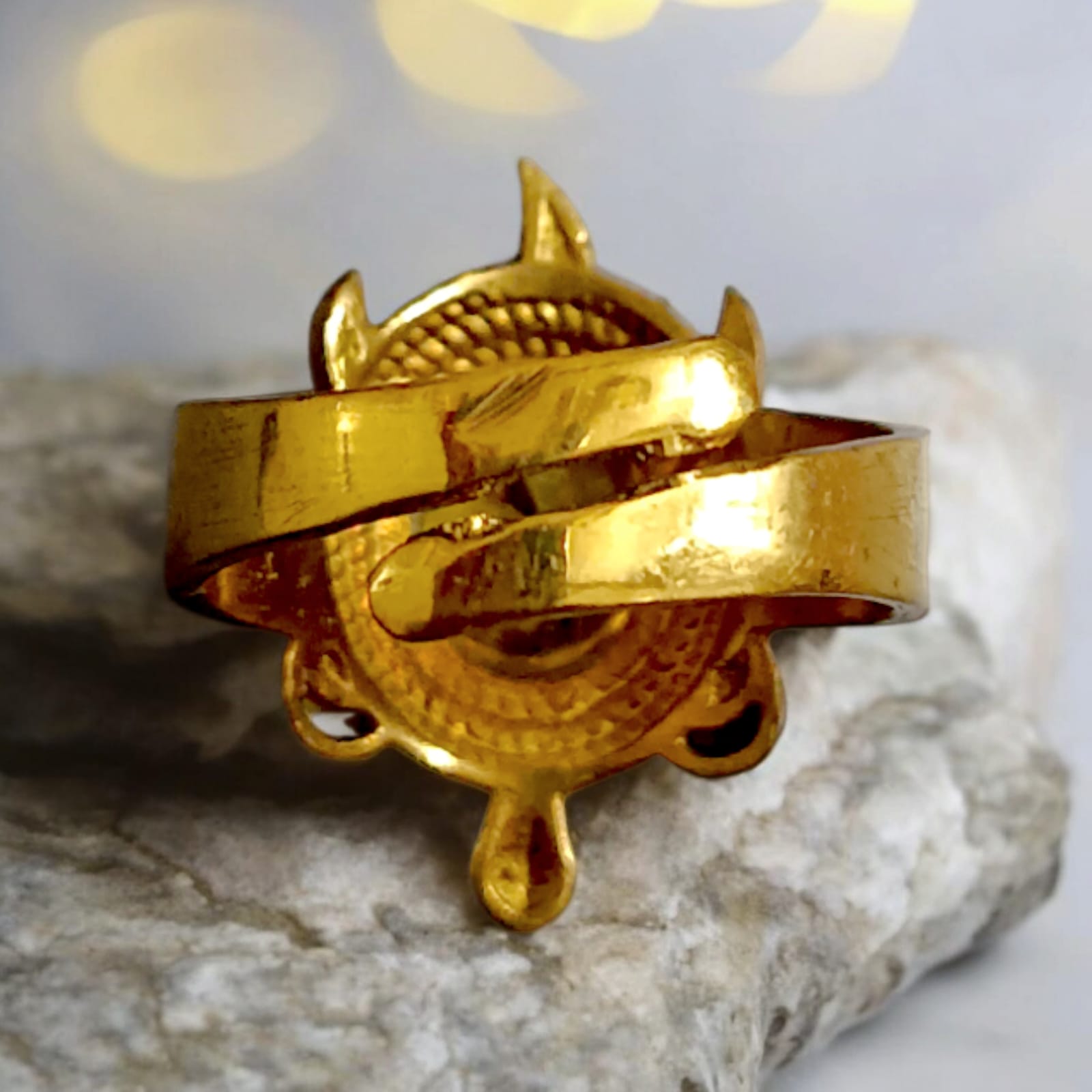 A close-up of the Kachua Pukhraj Ring, featuring a bright yellow Pukhraj (Yellow Sapphire) gemstone set in a tortoise-shaped design made from Ashtdhatu. The ring is adjustable and suitable for both men and women.