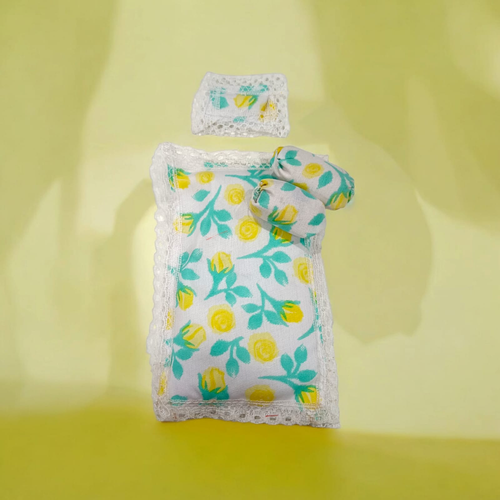 A colorful set of 5 cushioned gaddi pillows in different colors, perfect for Laddu Gopal idols of size 0-3, offering comfort and style in pooja settings.