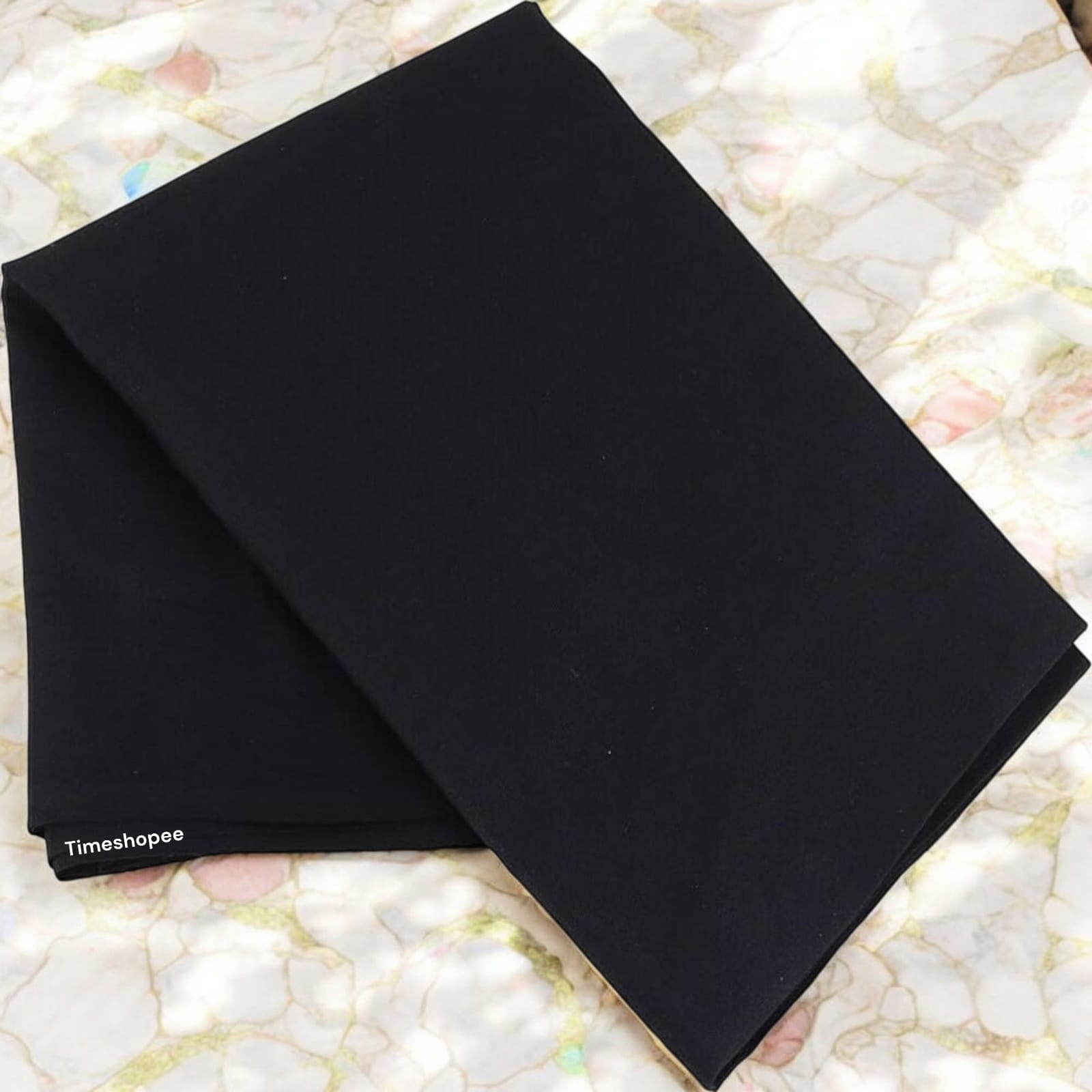A folded 1.25-meter black cloth for pooja, used for rituals, protection, and absorbing negative energy in religious practices.