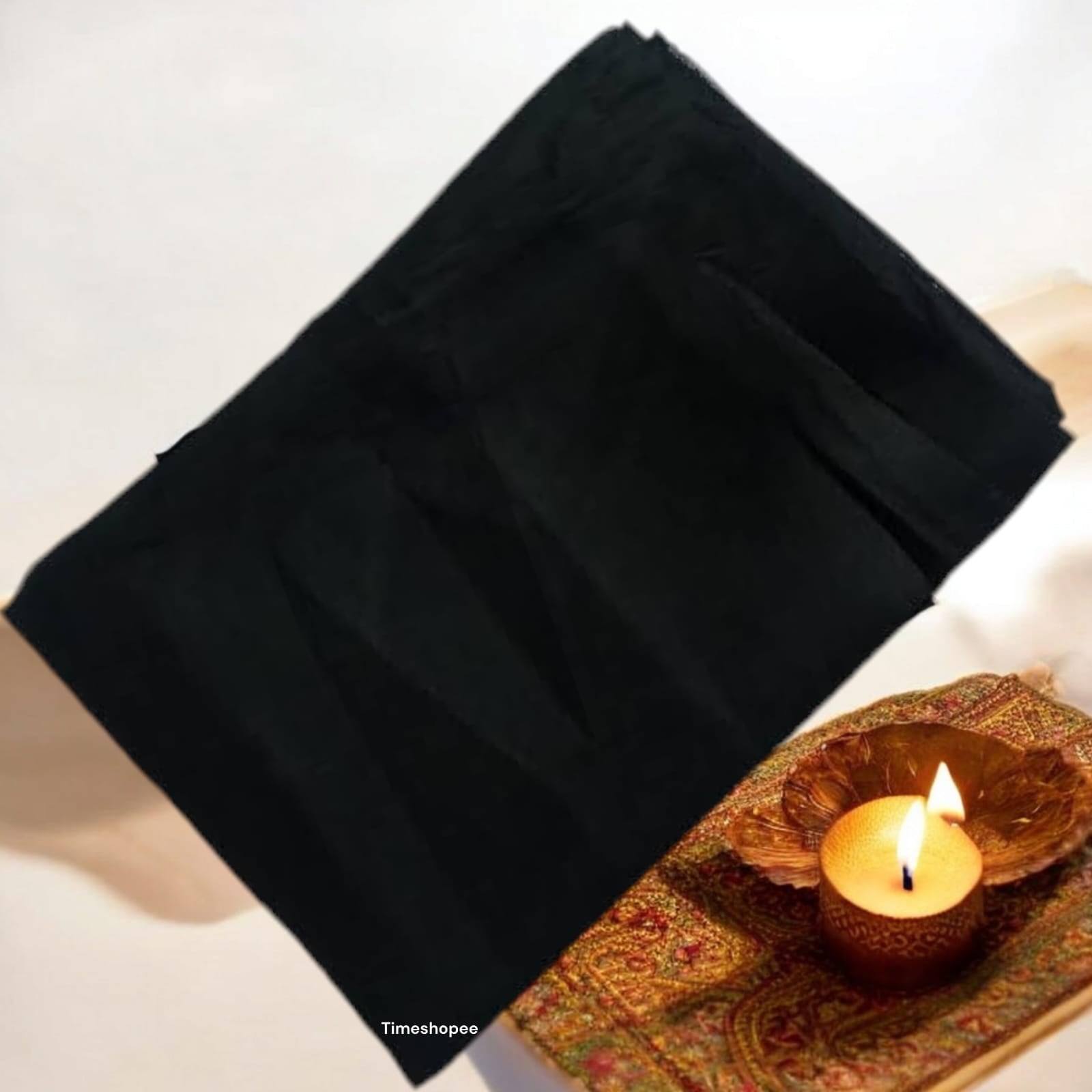 A folded 1.25-meter black cloth for pooja, used for rituals, protection, and absorbing negative energy in religious practices.