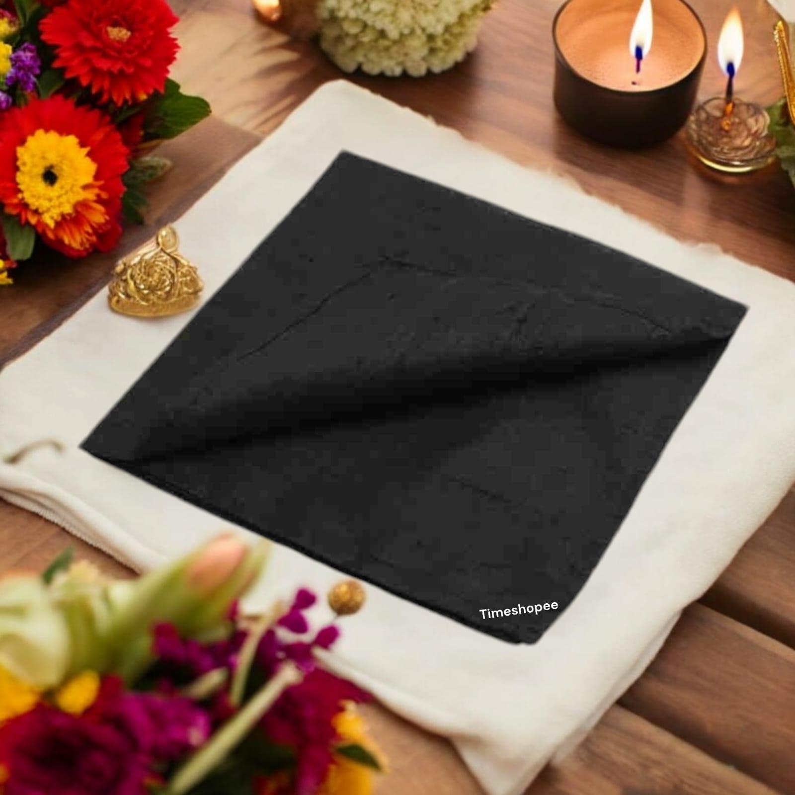 A folded 1.25-meter black cloth for pooja, used for rituals, protection, and absorbing negative energy in religious practices.