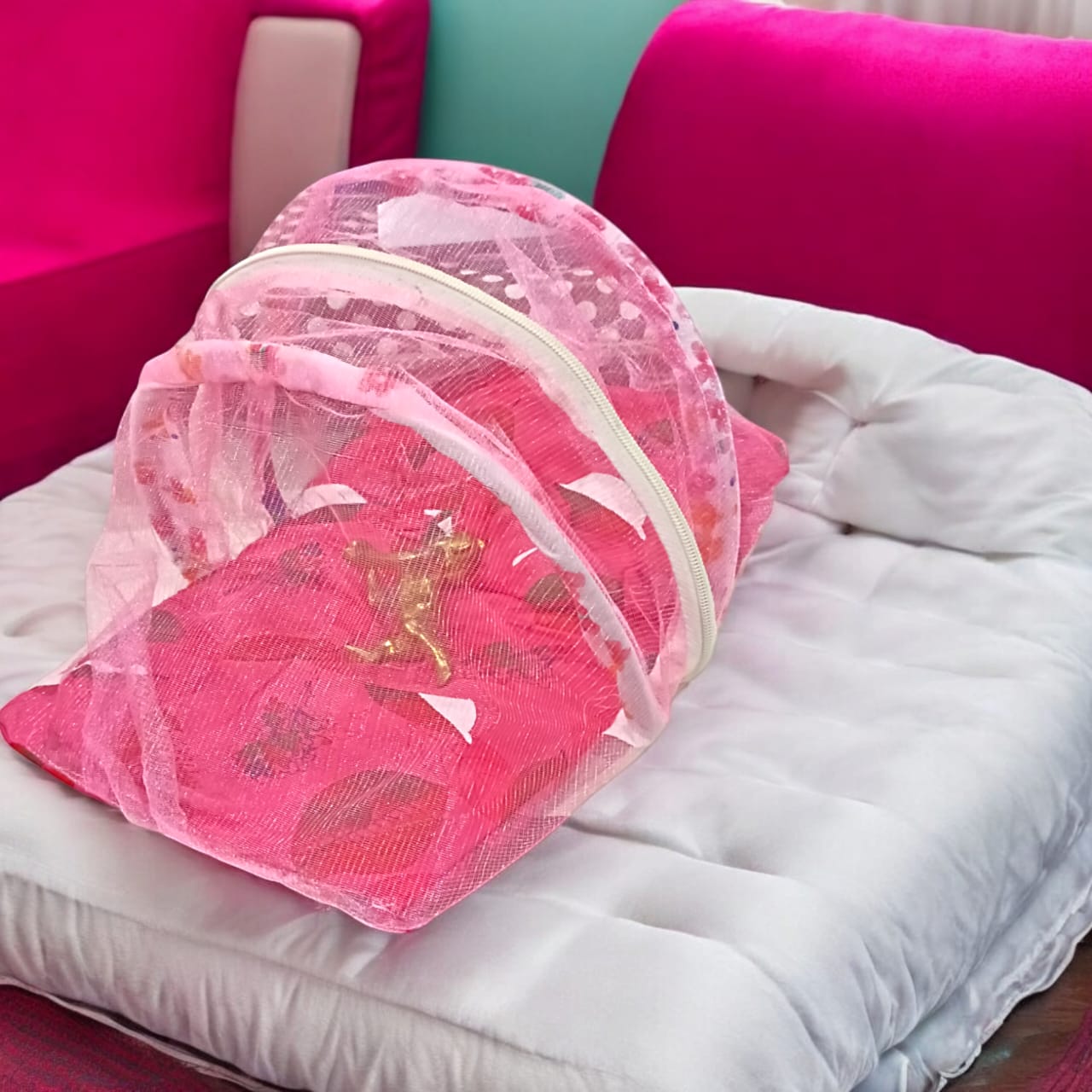 A large 10X13 inch comfortable bed with a mosquito net and three pillows, designed for Laddu Gopal or Radha Rani, available in Pink and Blue for home temple use.