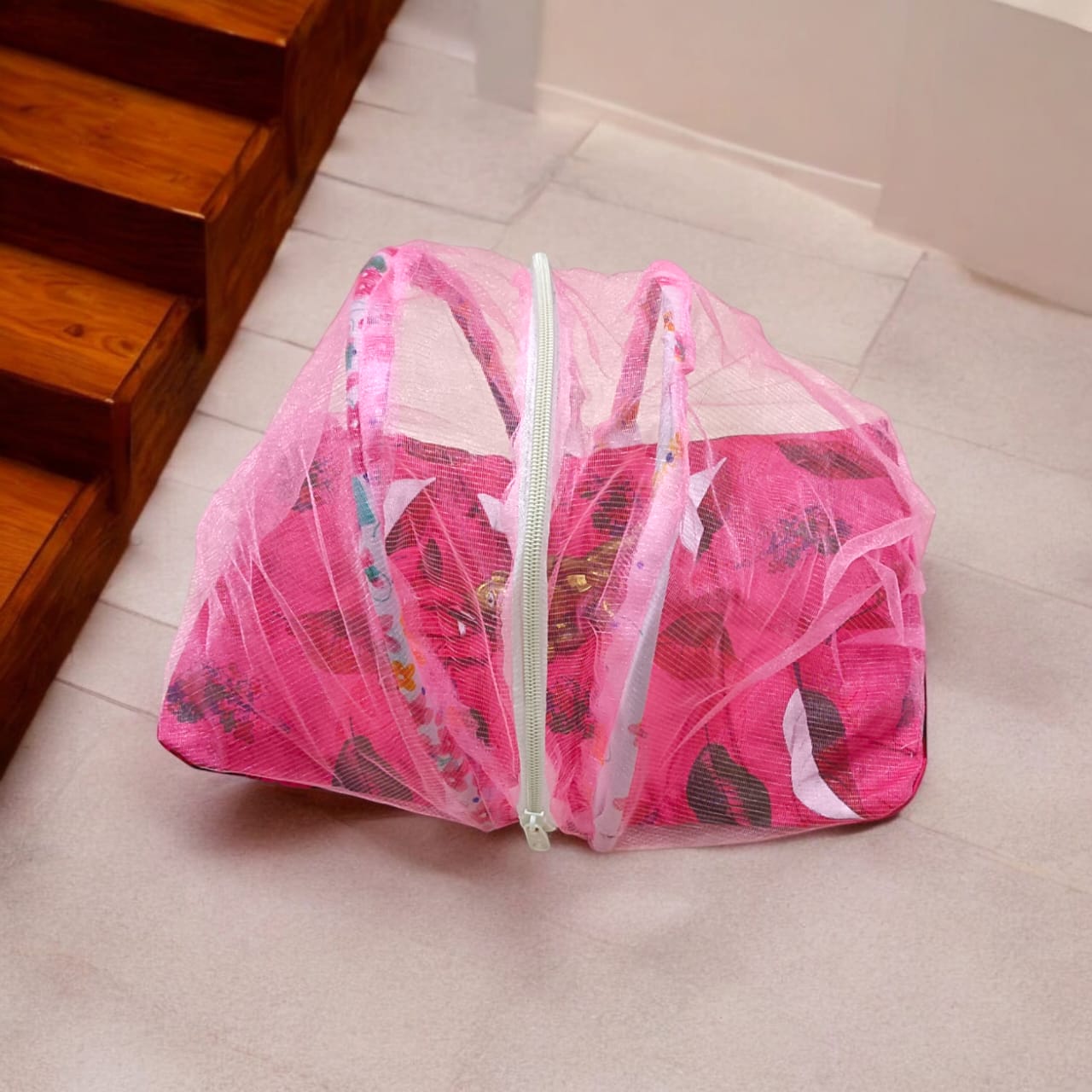 A large 10X13 inch comfortable bed with a mosquito net and three pillows, designed for Laddu Gopal or Radha Rani, available in Pink and Blue for home temple use.
