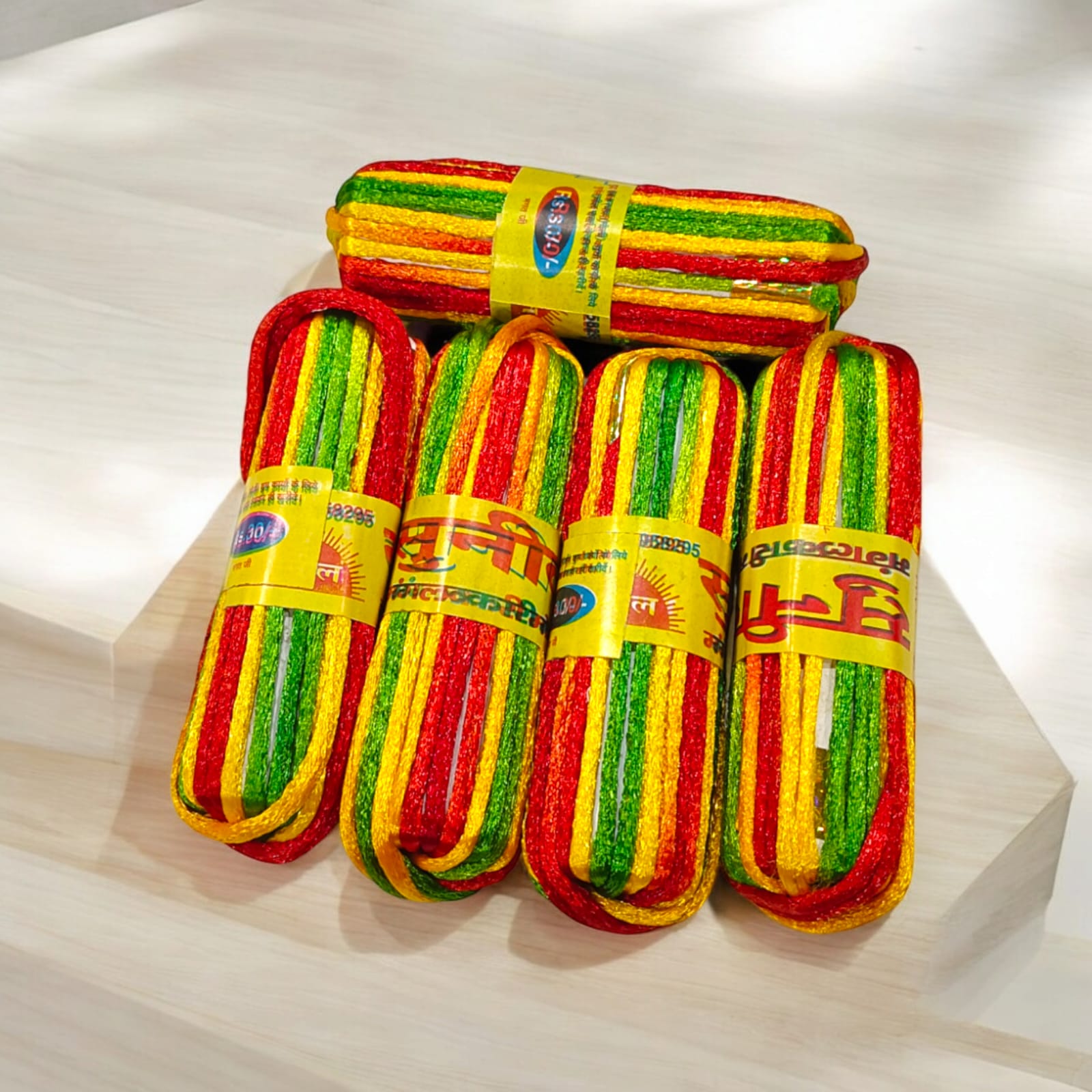 A pack of 5 colorful silk moli threads, each 11 feet long, traditionally used in Hindu pooja rituals for protection, blessings, and mannat dhaga ceremonies.