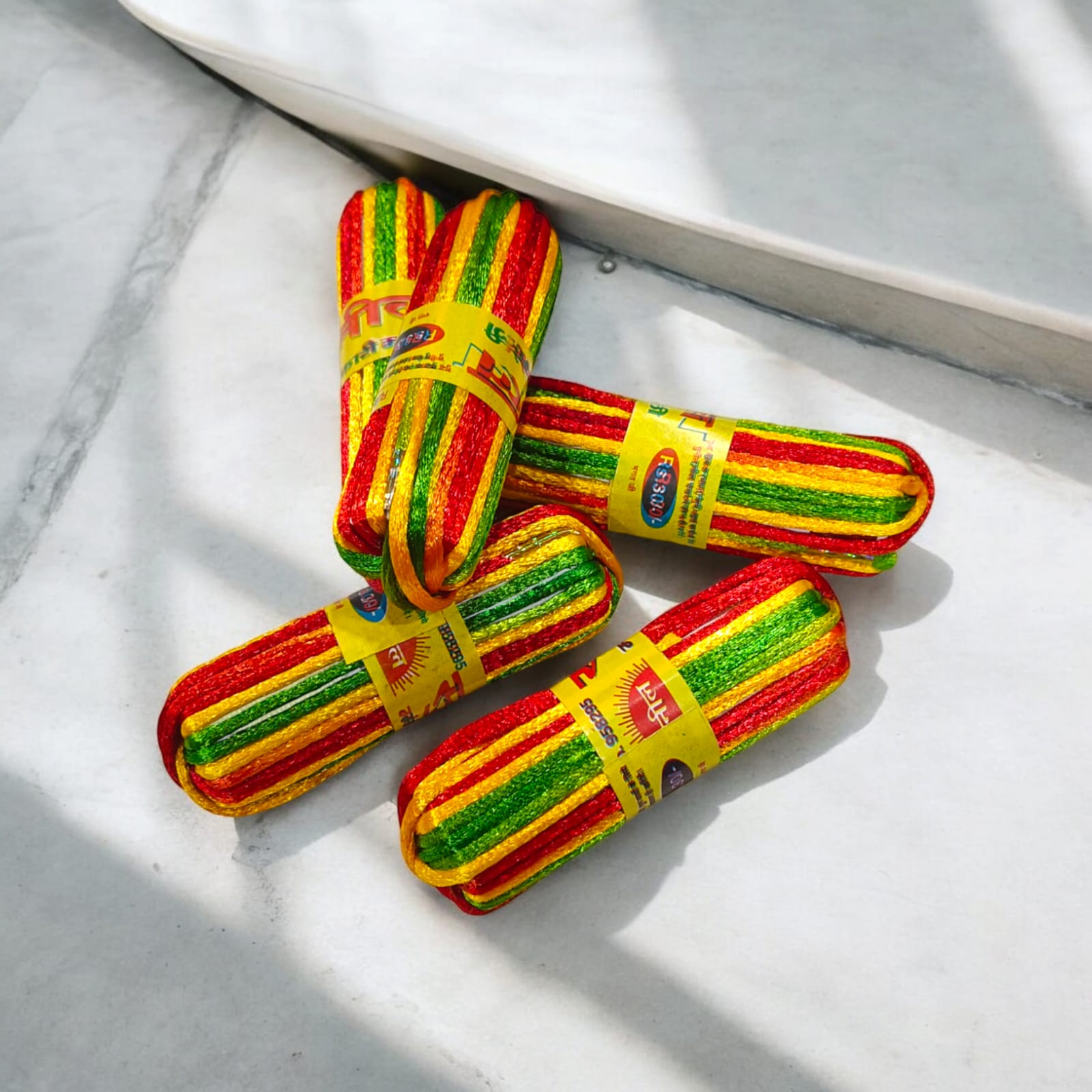 A pack of 5 colorful silk moli threads, each 11 feet long, traditionally used in Hindu pooja rituals for protection, blessings, and mannat dhaga ceremonies.